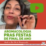 A imagem mostra a foto da Mayra falando algo e frisando a fala com os dedos das mãos. O texto da imagem: aromacologia pras festas de final de ano. Assista no You Tube da @ mayra c castro. Completam a imagem o desenho de uma janela aberta com floreira, que é o logo da Casa Máy, fundada em 2009, e o site www.casamay.com.br.
