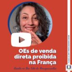 A imagem mostra a foto do rosto da Mayra, rindo, com as sobrancelhas arqueadas e a palma da mão voltada para frente, como se falasse algo. Ela tem cabelos castanhos grisalhos médio e ondulados e usa brincos em formato de argola grande prateada. Há o logo do You Tube e o texto: O Es de venda direta proibida na França. Assista no You Tube da @ mayra c castro. Completam a imagem o desenho de uma janela aberta com floreira, que é o logo da Casa Máy, fundada em 2009, e o site www.casamay.com.br.